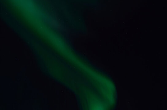 majestic aurora borealis on dark star filled night sky background