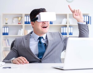 Businessman with virtual reality glasses in modern technology co