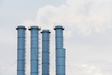 Chemical factory smoke pipes, copy space.