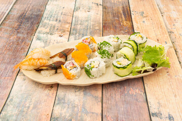 Ration of uramaki on wooden table
