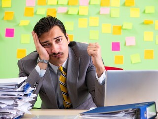 Businessman having trouble with his priorities