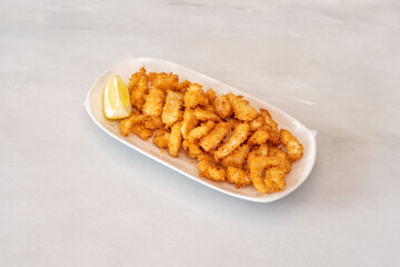 Dish of rabas squid rings with lemon