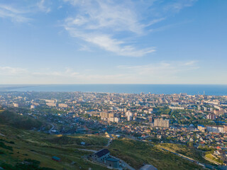 Naklejka premium Landscape made from the mountain of Makhachkala city in Russia with a clear blue sky above the ocean. 