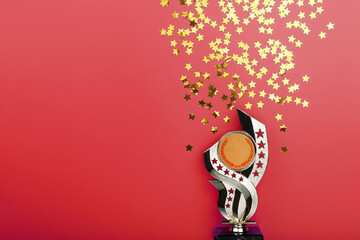 Golden Superprize with a scattering of stars on a red background.