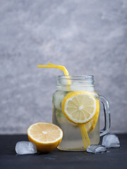 summer refreshing lemonade with lemon and mint or Mojito in a jar. Iced summer drink