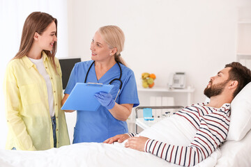 Young woman visiting her husband in hospital