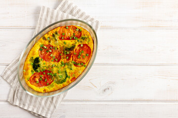 Tasty casserole with broccoli and vegetables in a glass baking dish