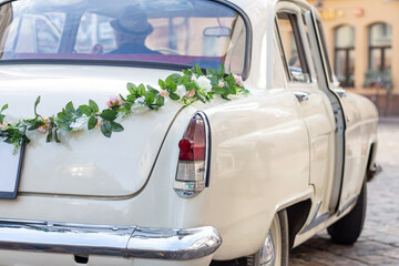 Beautiful wedding car decorated with flowers