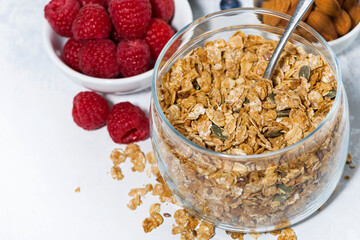 healthy breakfast. granola and fresh berries on white background, closeup