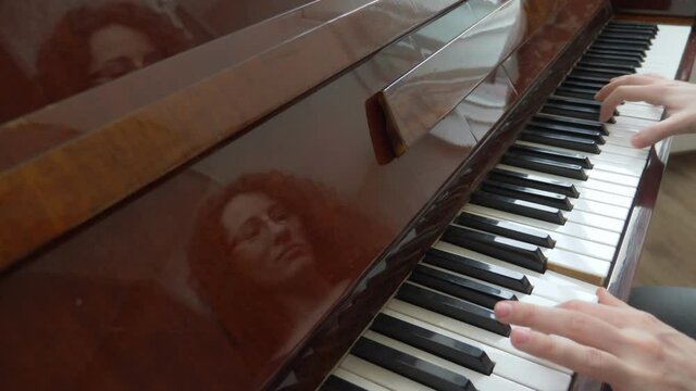 closeup. female hands masterfully play the arpeggio on the piano