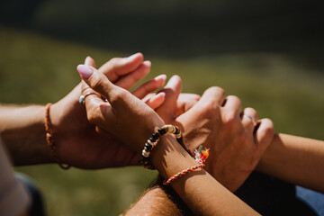 man and woman holding each other's hands, close-up, in nature, outdoors, hugs, tenderness