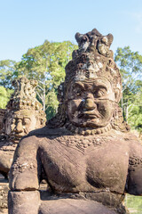 Stone Statue at the South Bayon Gate to Bayon Temple at the Angkor Wat Complex Near Siem Reap...