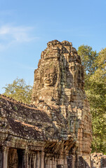Fototapeta premium Buddha Faced Tower at the Bayon Temple at the Angkor Wat Complex in Siem Reap Cambodia