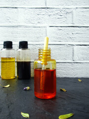 Sea buckthorn oil for skin care in a bottle and pipette