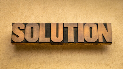 solution word in vintage wood type, business and science concept