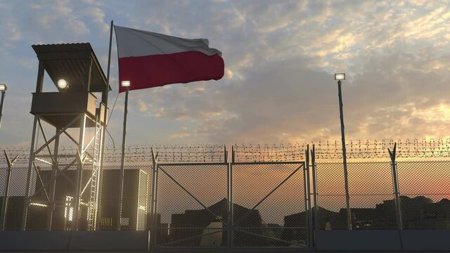 Flying flag of Poland above military base in the evening