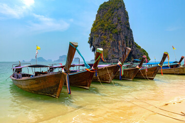 Thai traditional longtaile boats close-up on Phra Nang Beach in Krabi province.