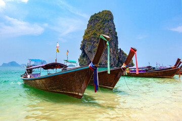 Thai traditional longtaile boats close-up on Phra Nang Beach in Krabi province.