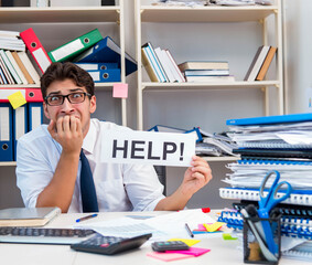 Busy frustrated businessman angry in the office