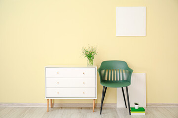 Interior of modern living room with chair and chest of drawers