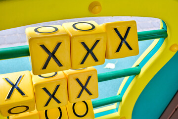 Tic-tac-toe puzzle game on playground for children education and activity
