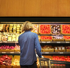 Supermarket shopping, face mask and gloves,man buying vegetables at the market	