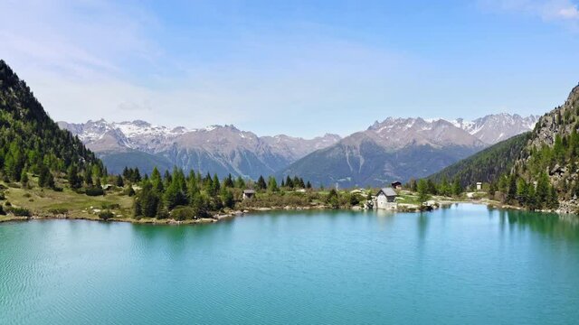 Flying Low over D'Aviolo Lake, Italy.
Aerial View of Colourful Turquoise Water. Mountains View. Blue Sky.