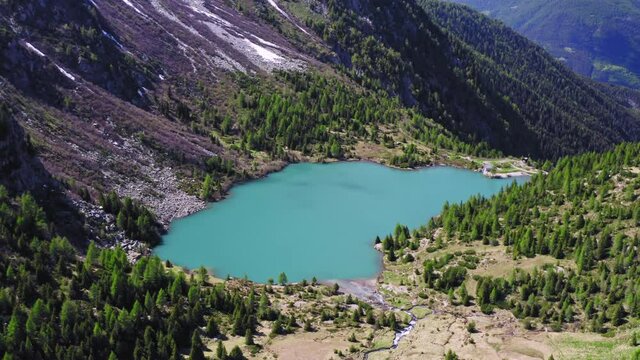 Aerial Drone View over D'Aviolo Lake, Edolo, Brescia, Italy.
Flying over Natural Lake in Adamello National Park.
Mountains View, Colourful Turquoise Water.