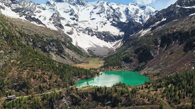 Aerial Drone View over D'Aviolo Lake, Edolo, Brescia, Italy.
Flying over Natural Lake in Adamello National Park.
Mountains View, Colourful Turquoise Water.