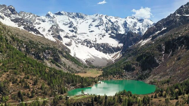 Aerial Drone View over D'Aviolo Lake, Edolo, Brescia, Italy.
Flying over Natural Lake in Adamello National Park.
Mountains View, Colourful Turquoise Water.