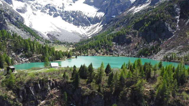 Aerial Drone View over D'Aviolo Lake, Edolo, Brescia, Italy.
Flying over Natural Lake in Adamello National Park.
Mountains View, Colourful Turquoise Water.