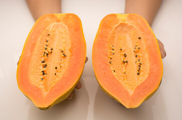 Ripe fresh papaya carica, on white background