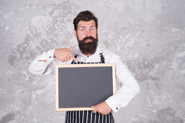 best chef menu. chalkboard with copy space for text. professional baker in apron. surprised barista with beard. advertisement and food. cook show empty board. presenting product. oh my god