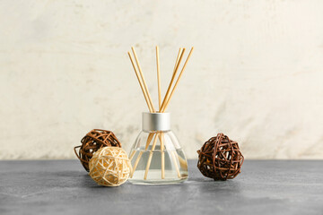Reed diffuser on grey table