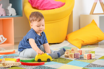 Cute little boy playing at home