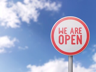 Obraz premium We are open - Road sign on blue sky background