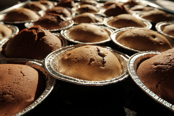 Warm cupcakes with chocolate and berries fresh from the oven