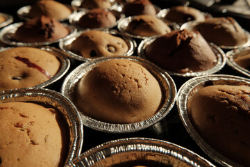 Warm cupcakes with chocolate and berries fresh from the oven