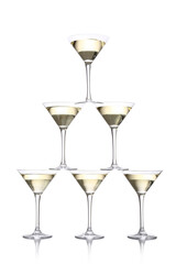 Tower made of glasses with champagne on white background