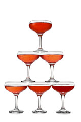 Tower made of glasses with champagne on white background