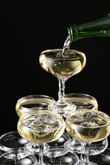 Champagne tower on dark background