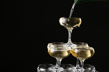 Champagne tower on dark background