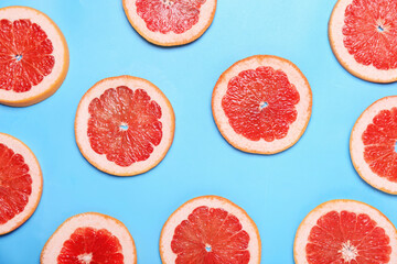 Fresh sliced grapefruit on color background