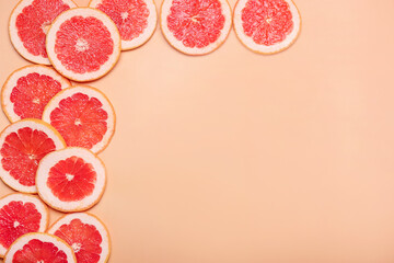 Fresh sliced grapefruit on color background