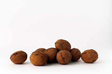 Walnuts lie on a white background. Healthly food.
