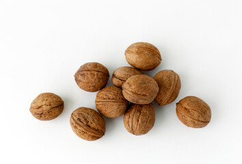 Walnuts lie on a white background. Healthy food close-up. View from above.
