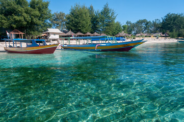 Fototapeta premium Ferry boats moored on the beach, Gili Air, Gili Islands, Indonesia
