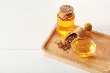Composition with flax oil on wooden table
