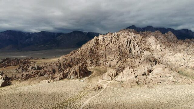 Aerial shot of a dramatic rugged landscape over the Alabama Hills and Mount Whitney in California USA