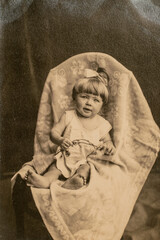 Latvia - CIRCA 1930s: Portrait of baby girl in studio. Vintage archive Art Deco era photography